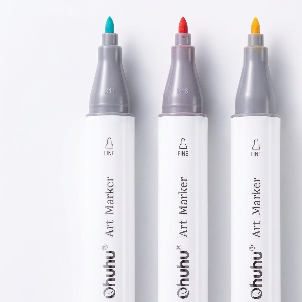 Four Ohuhu art markers with different colored caps on a white background